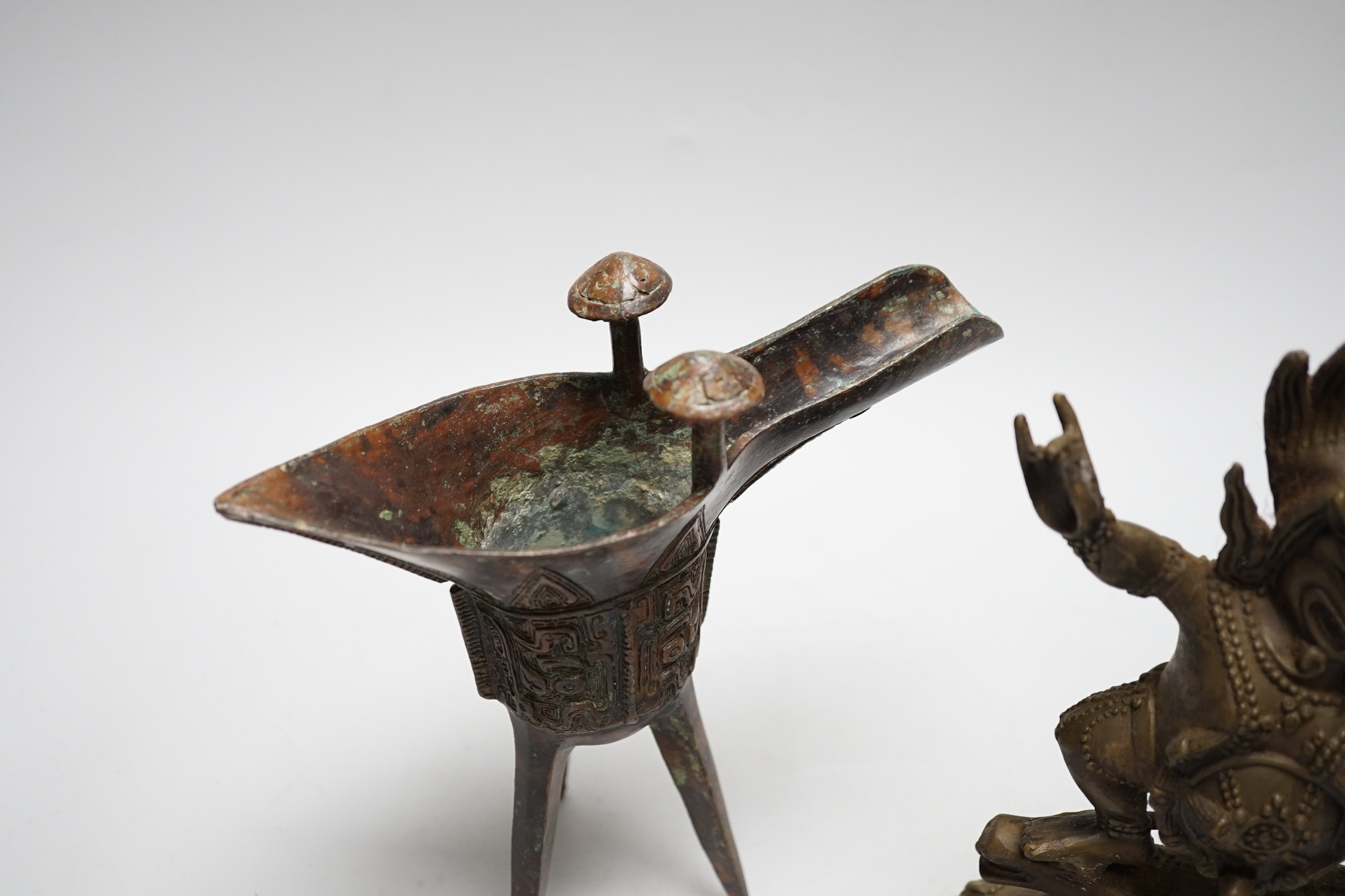 A Buddhist bronze figure and a bronze yi vessel, figure 22cm high